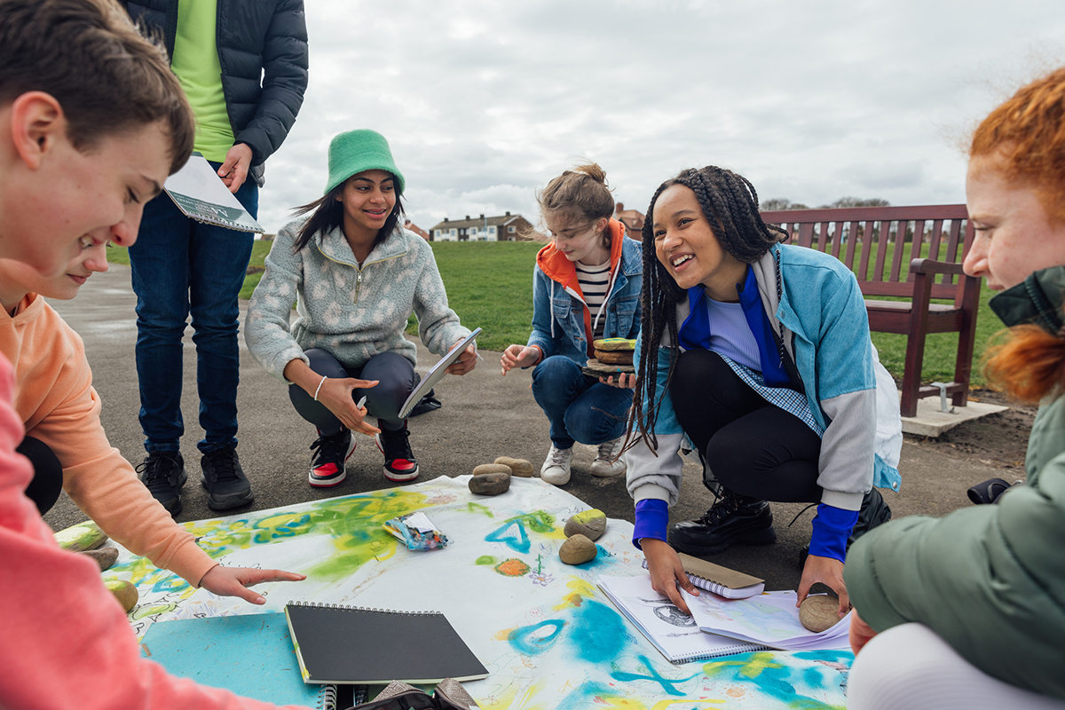 Group of students work on a project for Earth Day.